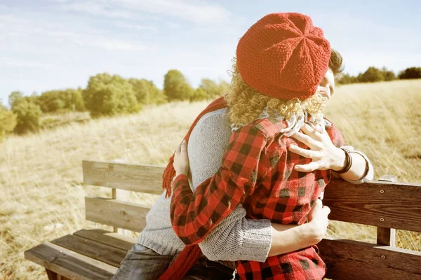 Happy Young Couple Love Hugging Sunbathing Wooden Bench Meadow Autumn — Stock Photo, Image