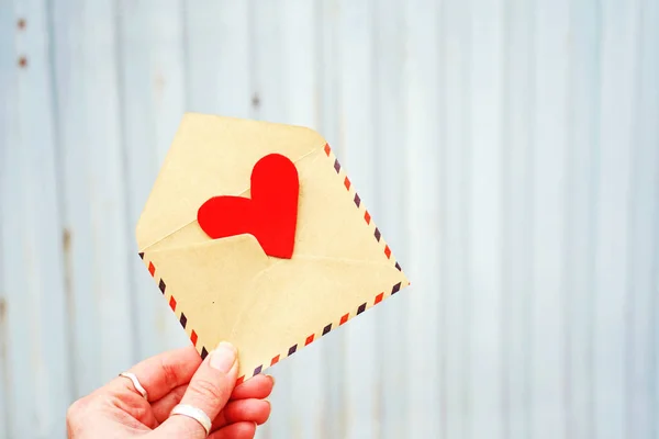 Red heart in postal envelope, valentine day background