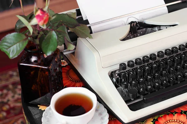 A typewriter, tea and a candle. Old things