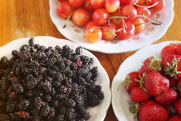 Berries on a plate. Cherries Strawberry. Mulberry