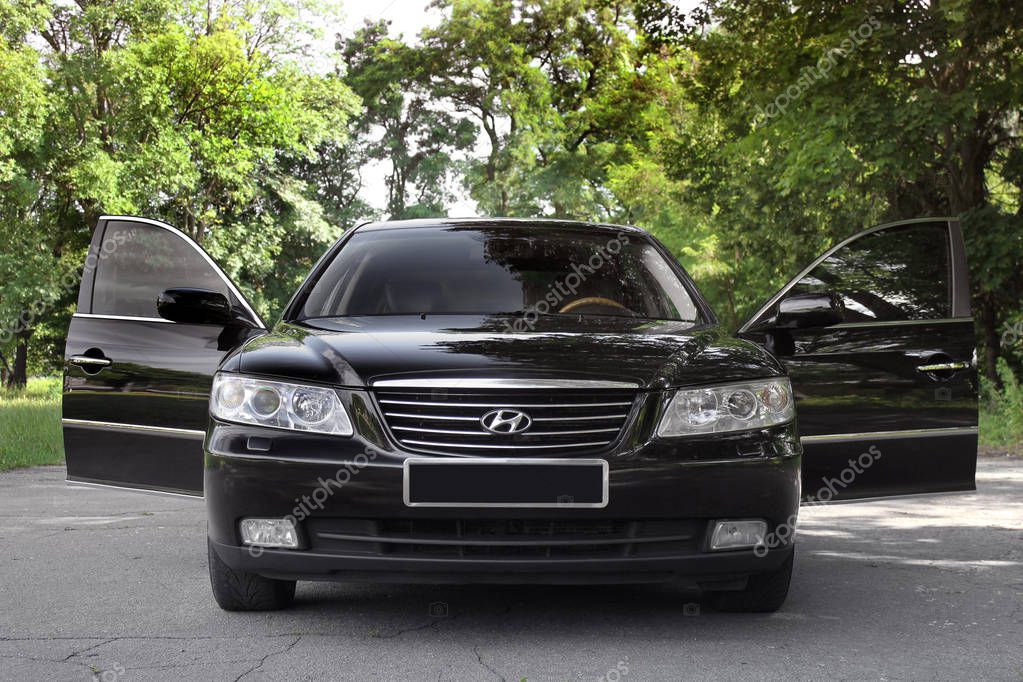 Kiev, Ukraine - August 6, 2018: Beautiful black Hyundai car in the background of a beautiful forest