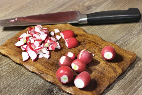 Radish on a cutting board. Cook food. Food in the kitchen