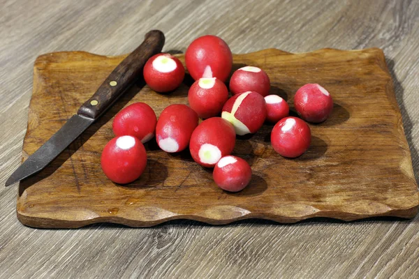 Radish on a cutting board. Cook food. Food in the kitchen