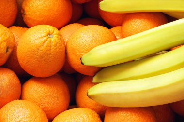 Portakallar ve muzlar. Portakal ve muzun geçmişi. Meyveler. Gıda arkaplanı