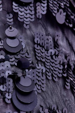 Parlak renklerin payetleri ve payetleri ile kumaş. Moda glitter kumaş, payetler. Parlak yüzey