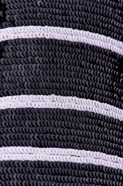 Parlak renklerin payetleri ve payetleri ile kumaş. Moda glitter kumaş, payetler. Parlak yüzey