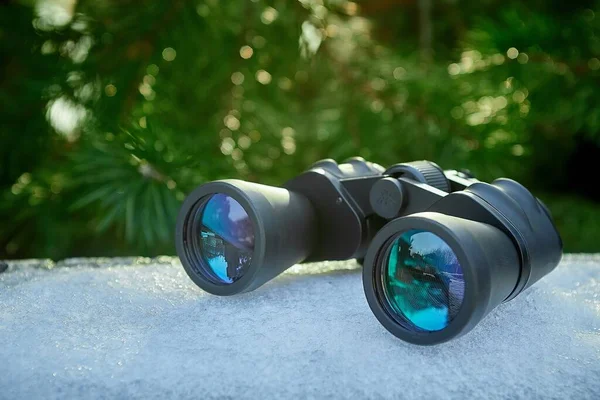 Binoculars are an excellent optical device for searching and observing during hunting, survival, and tracking Stock Picture