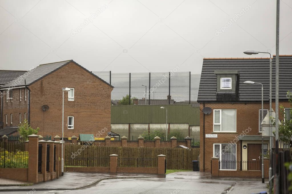 Homes near wall permanently dividing Protestant and Catholic Belfast neighborhoods
