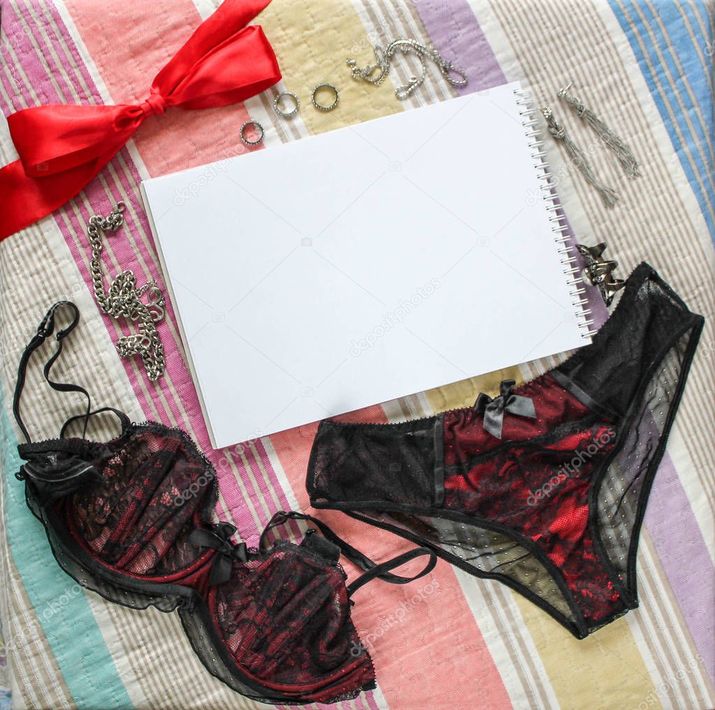 Lingerie and notebook. Top view.