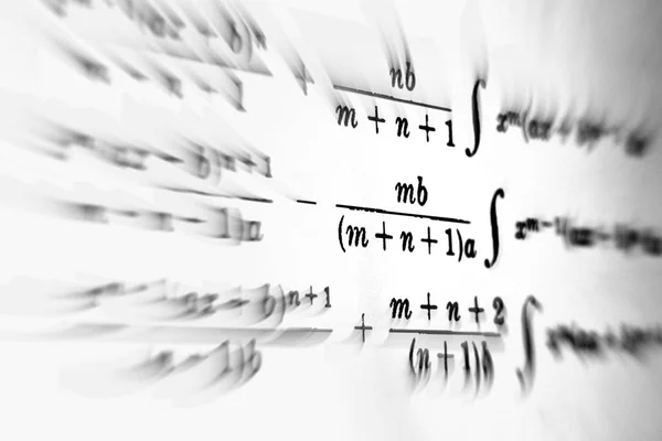 Large number of mathematical formulas focus zoom on a white background