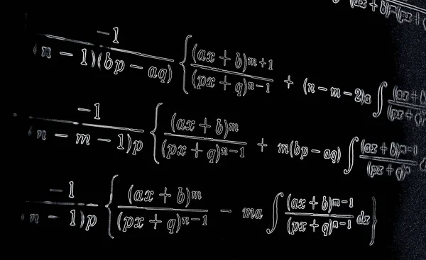 Large number of mathematical formulas neon on a black  background