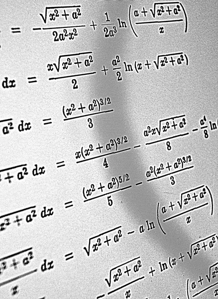 Large number of mathematical formulas on a white background HDR