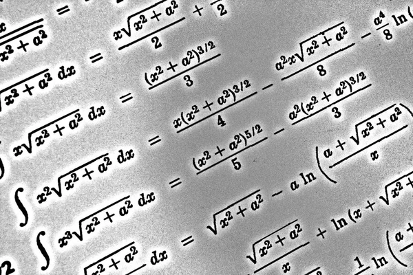 Large number of mathematical formulas on a white background HDR