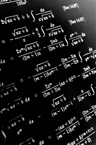 Large number of mathematical formulas on a black background