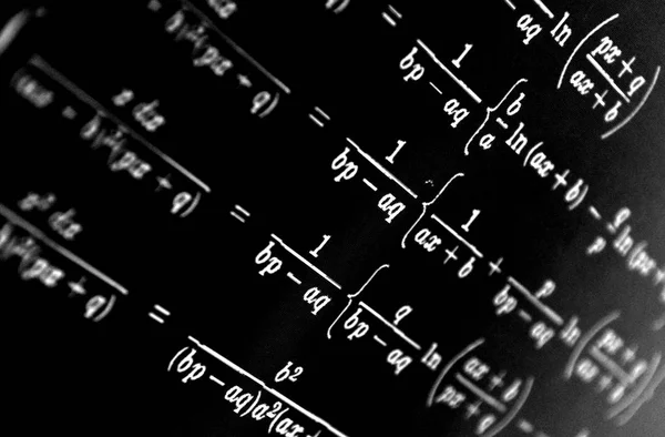 Large number of mathematical formulas on a black background