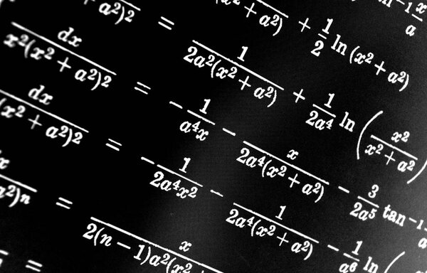 Large number of mathematical formulas on a black background