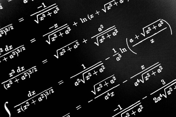 Large number of mathematical formulas on a black background