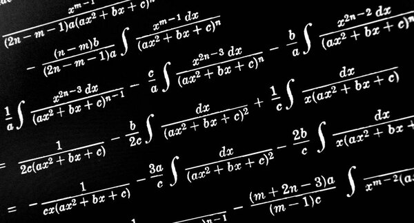 Large number of mathematical formulas on a black background