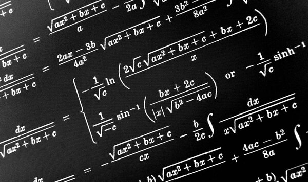 Large number of mathematical formulas on a black background
