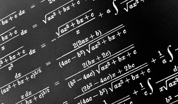 Large number of mathematical formulas on a black background