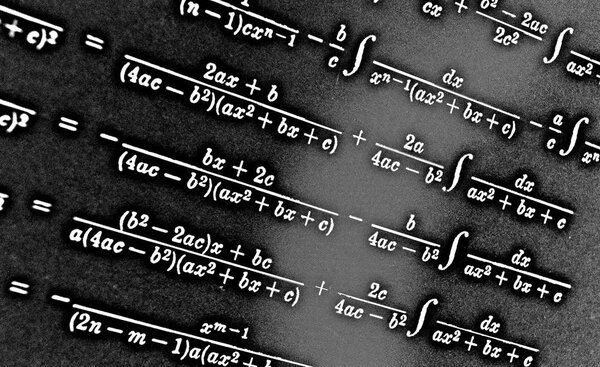 Large number of mathematical formulas on a black background HDR