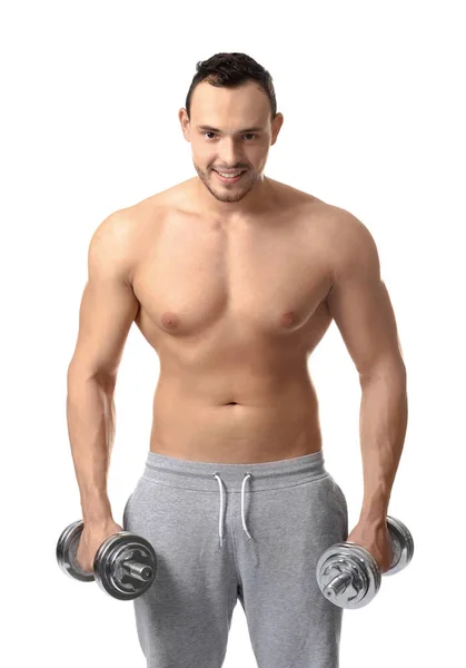 Muscular young bodybuilder with dumb-bells on white background — Stock Photo, Image