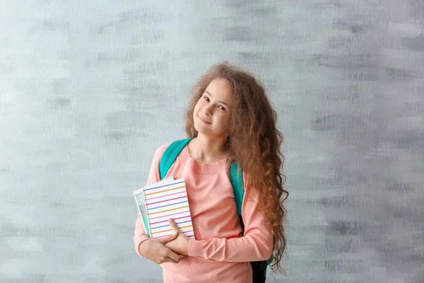 Stylish teenager with books — Stock Photo, Image