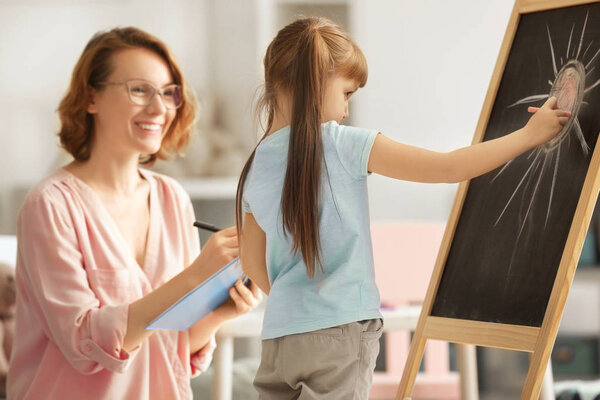 little girl with female psychologist