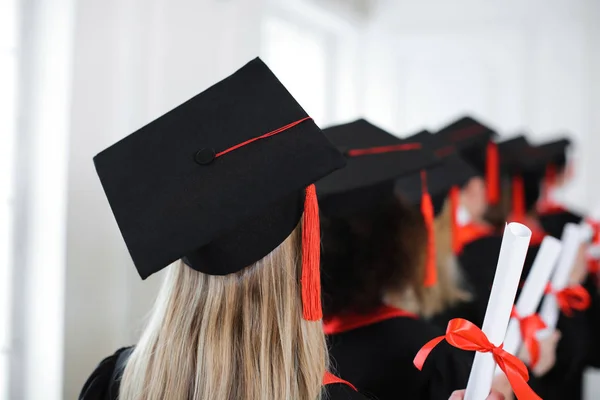 Student in mortarboard indoors — Stock Photo, Image