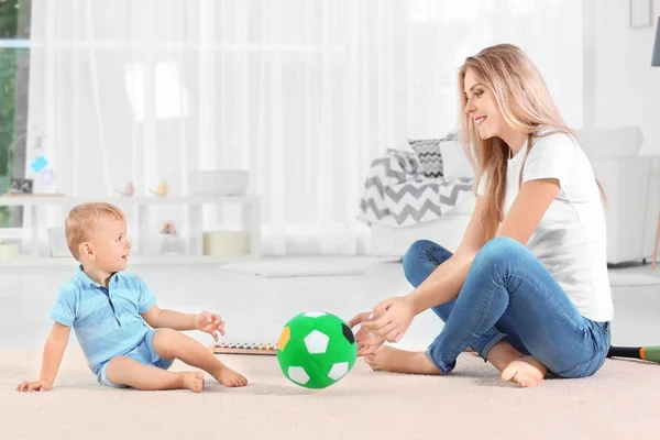 Cute baby and mother playing at home — Stock Photo, Image