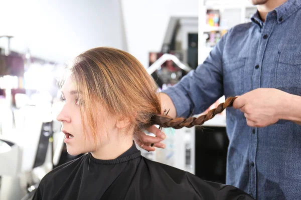 Professional stylist cutting off braid — Stock Photo, Image