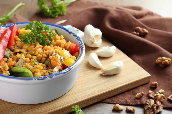 Tasty lentil dish on wooden board — Stock Photo, Image