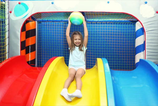 Little Girl Riding Slide Entertainment Center — Stock Photo, Image