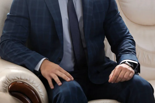 Young Man Elegant Suit Sitting Sofa Indoors — Stock Photo, Image