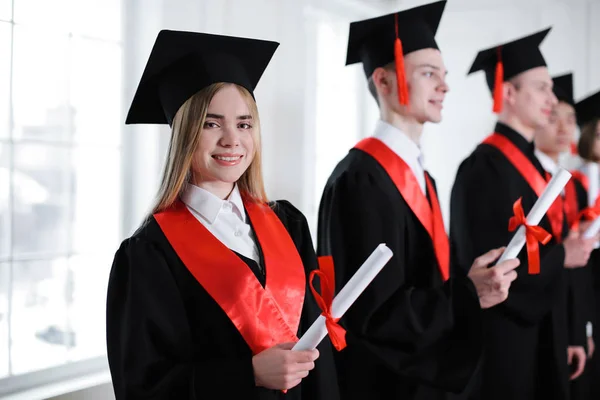 Students Bachelor Robes Diplomas Indoors Graduation Day — Stock Photo, Image