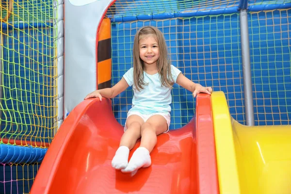 Little Girl Riding Slide Entertainment Center — Stock Photo, Image