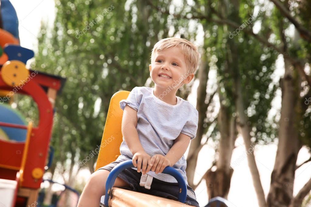 Cute little boy on children's playground