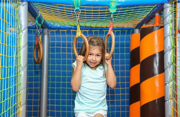 Cute Girl Playing Entertainment Center — Stock Photo, Image