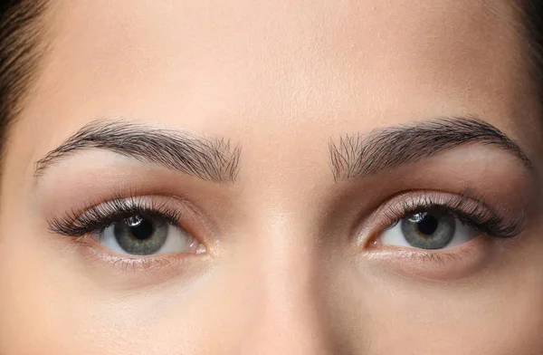 Young woman with natural eyebrows, closeup