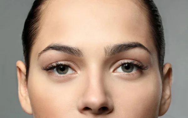 Young woman with natural eyebrows, closeup