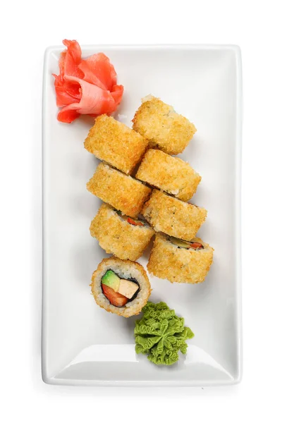 Placa com saborosos rolos de sushi no fundo branco, vista superior — Fotografia de Stock