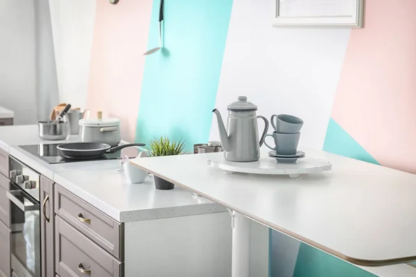 Tea set on table in modern kitchen — Stock Photo, Image