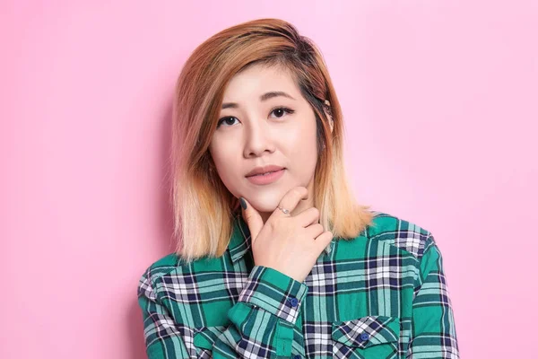 Portrait of beautiful Asian woman on color background — Stock Photo, Image