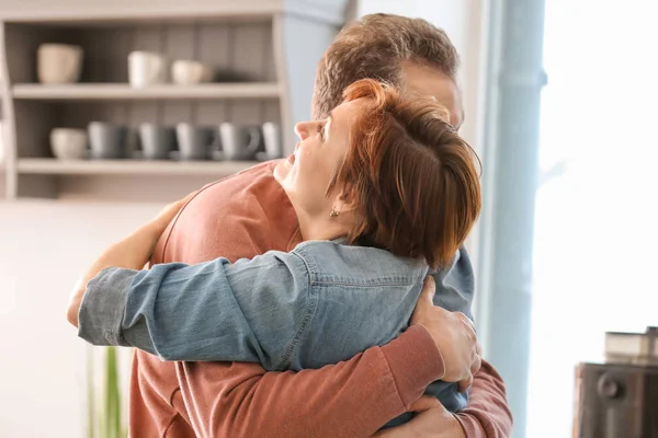 Happy Mature Couple Hugging Home — Stock Photo, Image