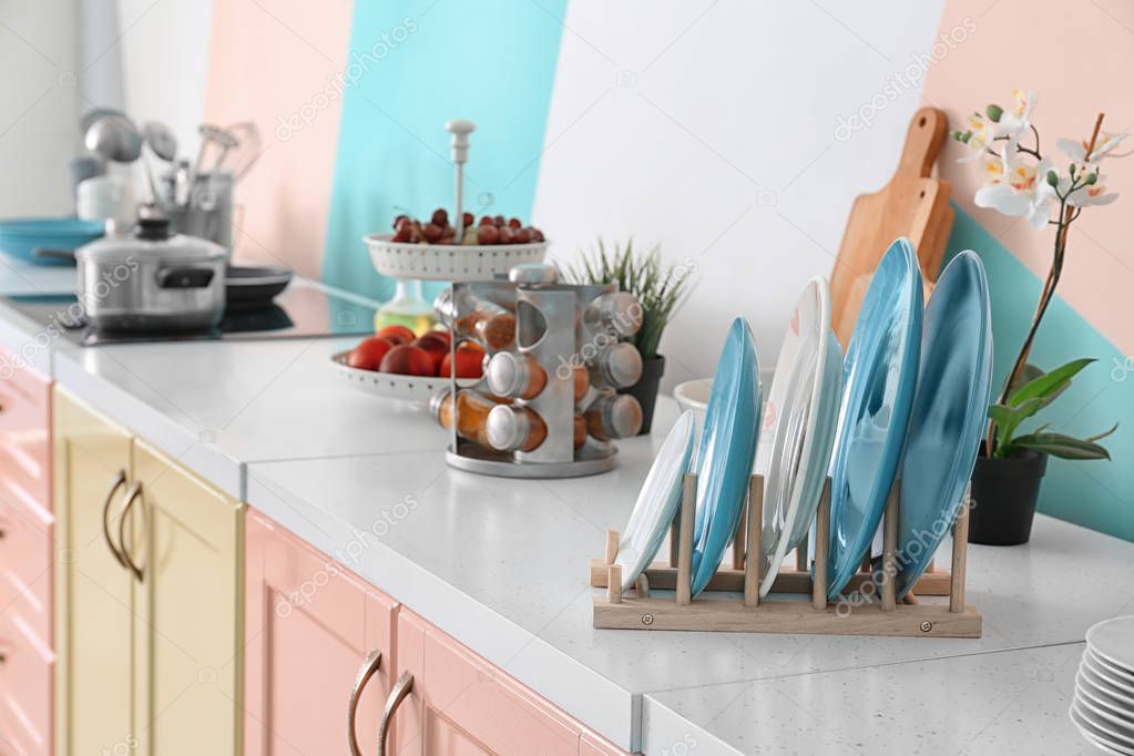 Plates on table in modern kitchen