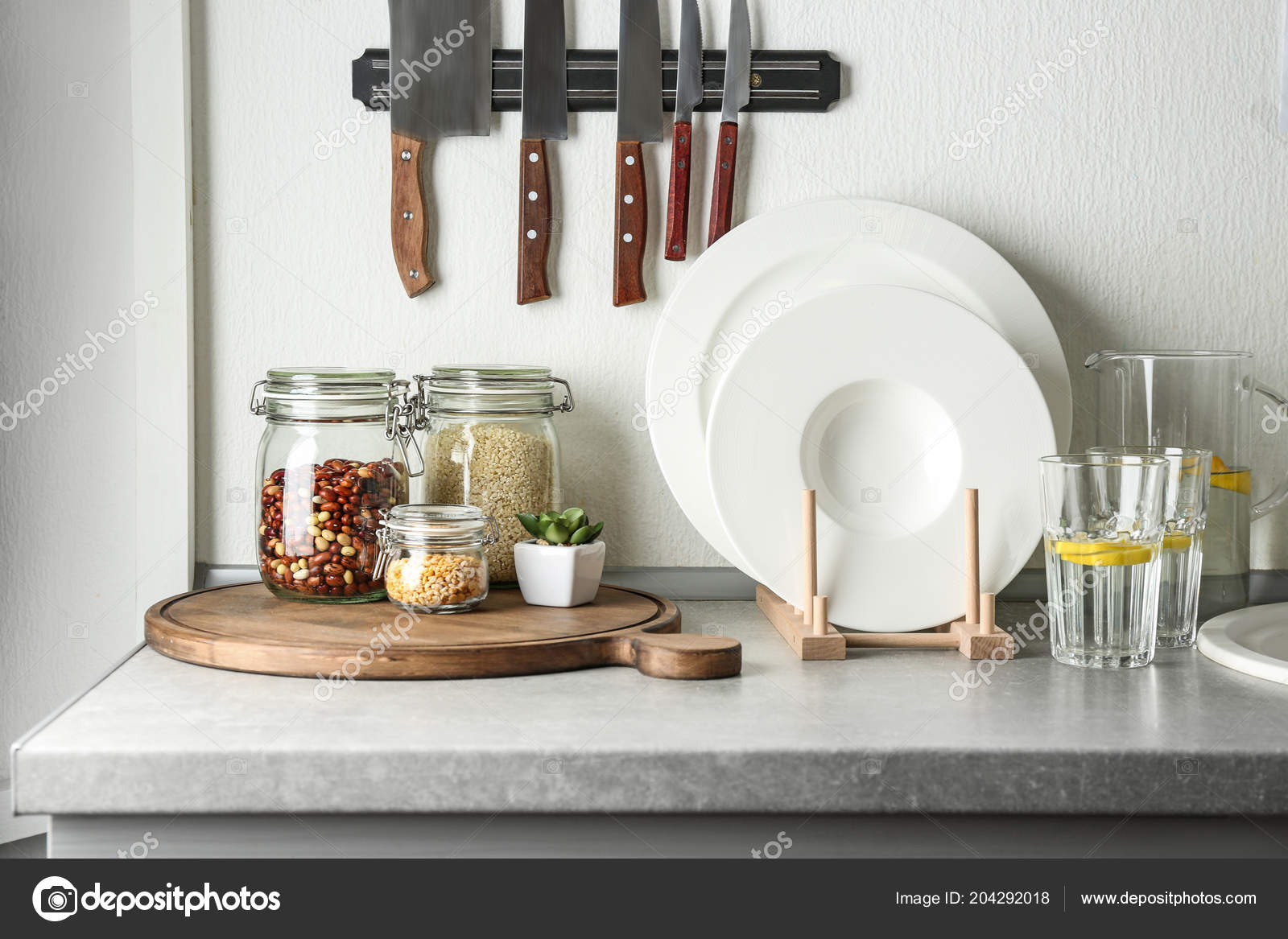 Kitchen Counter Glass Jars Knives Set White Plates Stock Photo by