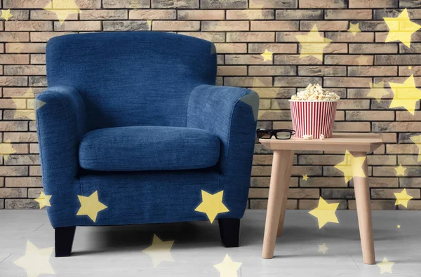 Comfortable armchair in home cinema. Shiny stars in foreground