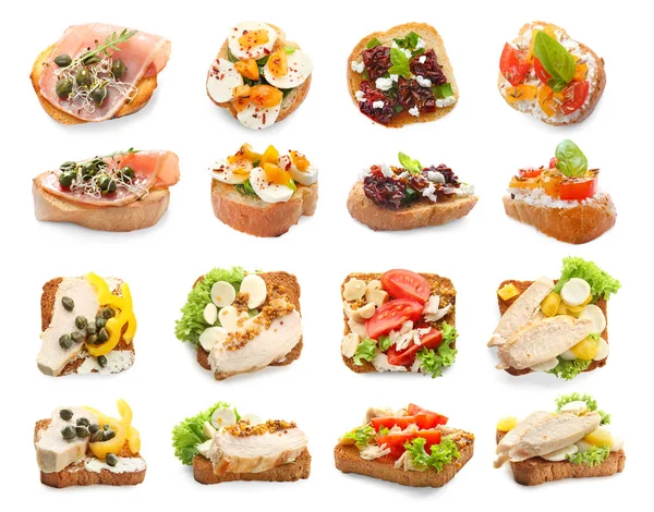 Set with different delicious bruschettas on white background — Stock Photo, Image