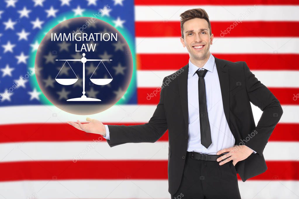 Young man holding virtual scales of justice with text IMMIGRATION LAW and American flag on background