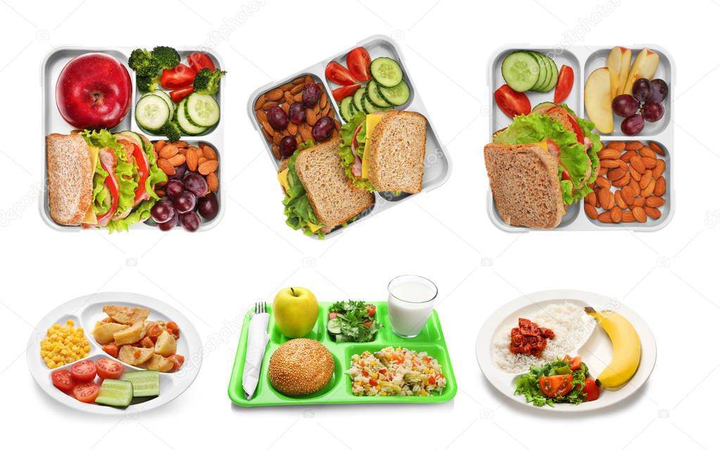 Set of serving trays with food for school lunch on white background